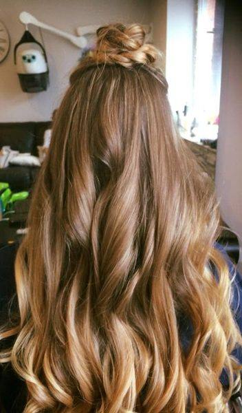 Balayage half-up style with caramel highlights