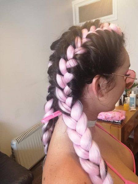 Dark hair with pink braid extension styling