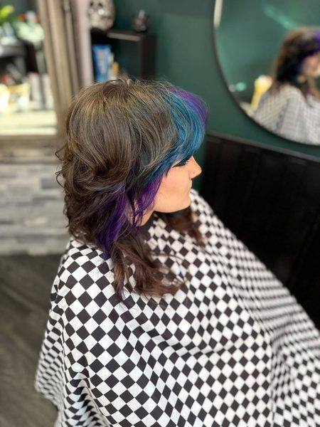 Dark hair with teal and purple hidden colour placement